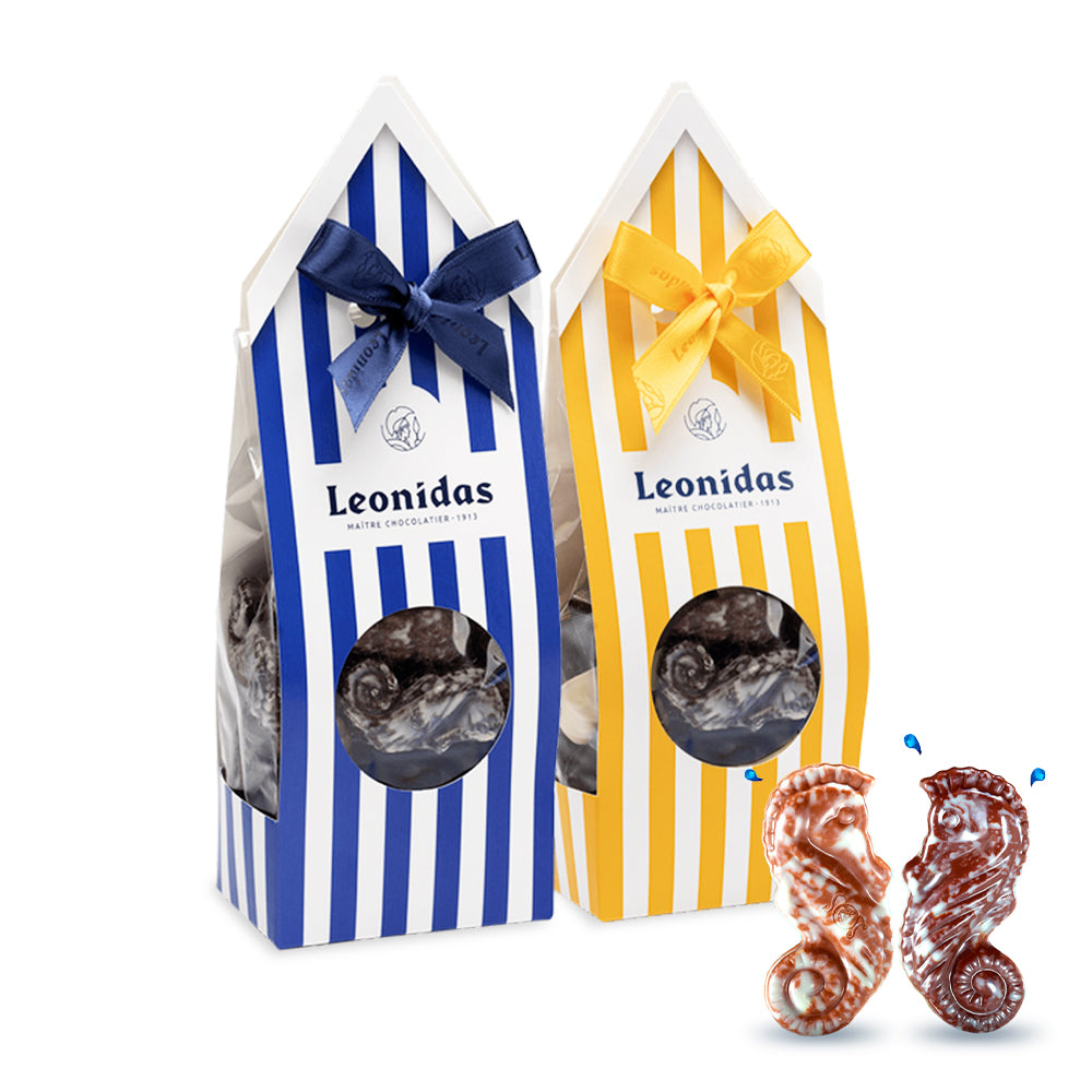 caixa alusiva ao verão com riscas azuis e amarelas com bombons frutos do mar de chocolate negro e chocolate de leite
