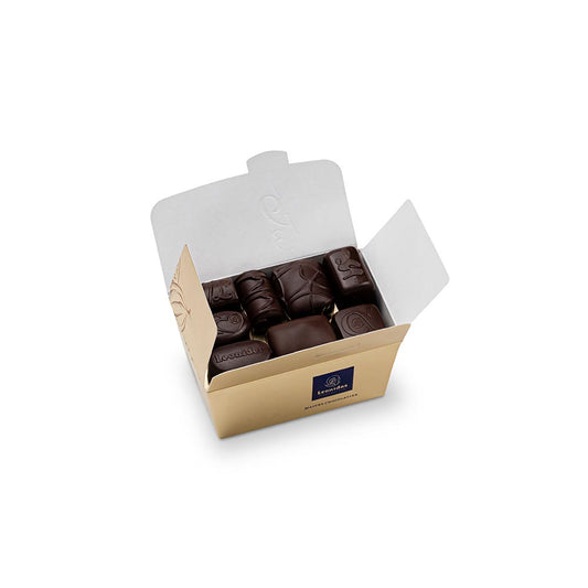 caixa dourada com bombons de chocolate negro da leonidas