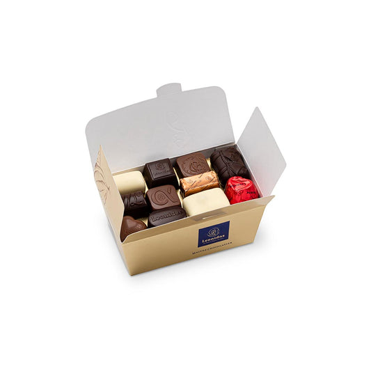 caixa dourada com bombons de chocolate sortidos da leonidas