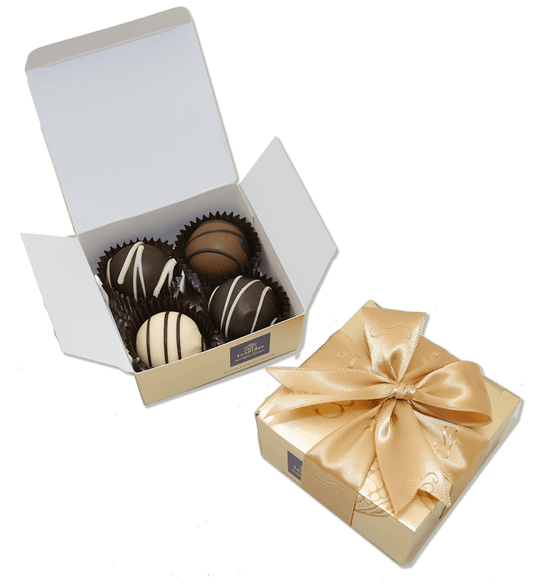 caixa quadrada dourada da Leonidas com 4 bombons de chocolate belga